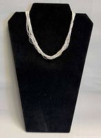 Necklace displayed on black bust showing overall appearance