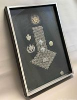 oblique view of entire framed display showing all insignia and frame construction