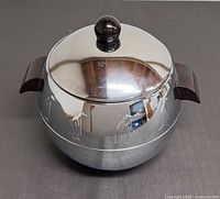 Front view of chrome penguin server with lid on