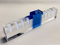 Front angled view showing blue central block and candle holes