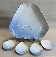 Triangular platter front with four shell dishes
