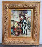 Frontal view of full framed artwork showing ornate gold frame and print