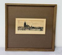 Front view of framed etching showing frame, mat and artwork