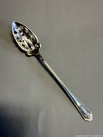 Full view of sterling pierced serving spoon