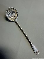 Full view of sterling sifter spoon front side
