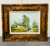 Front view of framed landscape painting