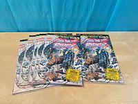 Six identical Ghost Rider #31 special collector’s item comic books fanned on tabletop