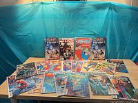 Group shot of all bagged & boarded comics laid on table and four upright for visibility