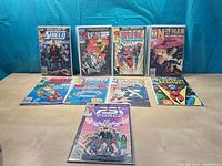 All ten comics arranged, showing covers and bag/board protection