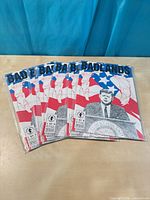 Six copies of Badlands #1 comics bagged and boarded, fanned on tabletop