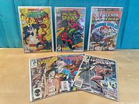 Six bagged Spider-Man comics displayed