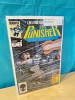 Front cover of The Punisher Limited Series #1 in protective sleeve and board