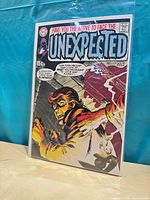 Front cover of The Unexpected #119 sealed in bag with board