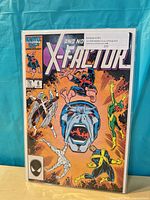 Front view of X-Factor #6 comic book in bag and board