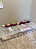 Closed tote with two wrapping paper rolls on top