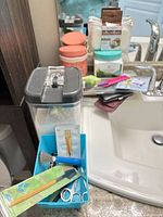 Overview showing storage container, body care jars and manicure tools