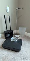 Overall lot showing scale, plunger/brush set, stainless plunger, waste can