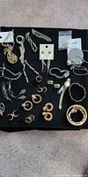 Overview of entire jewellery lot on black cloth