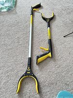 Both grabber tools side by side to show size difference