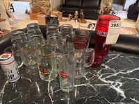 Group shot of all beer mugs and glasses on countertop