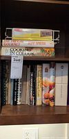 Shelf view showing The Frugal Gourmet, Cooking in Colour and assorted cookbooks