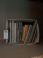 Box filled with upright magazines and brochures