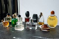 All twelve mini perfume bottles grouped on tabletop
