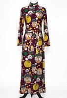 Front full view of printed maxi dress on mannequin with belt