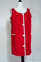Front view of red sleeveless dress on mannequin