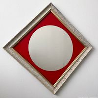 Full view of square mirror hung on point