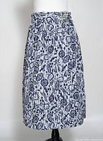 Front view of navy and white patterned wrap skirt on mannequin