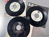 Overview of all three 7" records showing labels