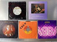 Front sleeves of five 7" singles