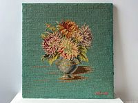 Full view of stitched flower bouquet panel on teal background