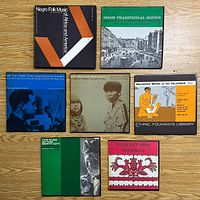 Seven record covers laid out