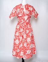 Full view of dress and jacket on mannequin