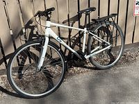 Left side view of the bicycle showing frame, wheels, drivetrain, rear rack