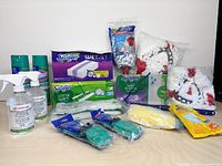 Full lot overview showing sprays, Swiffer refills, mop heads, scrub pads, microfiber cloth