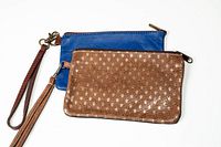 Brown and blue leather wristlets with straps