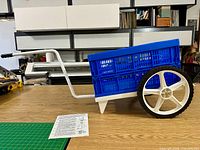 Cart assembled with crate attached, showing handle and wheels