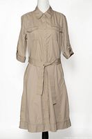 Front view of khaki cotton safari dress on mannequin