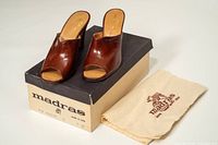 mules displayed on original box with cloth beside