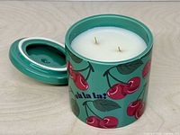 Jar open showing white wax and two wicks