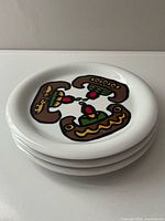 Stack of three Marc Tétro canoe design plates