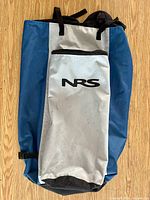 Front view of NRS SUP backpack showing color, pocket and drawstring top