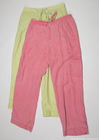 Pastel pink and green linen pants together