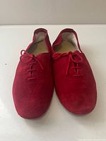 Top view of pair showing red suede uppers and laces
