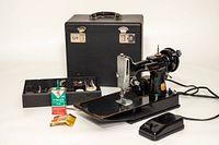 Sewing machine with case, foot pedal, oil, accessory tray
