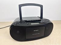 Front view of Sony CFD-S50 boombox with handle raised
