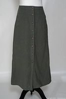 Full view of dark sage button-front skirt on mannequin